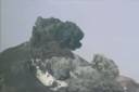 Volcano explosion showing a plume of ash