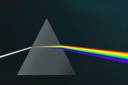 Light going through a prism to be broken into the rainbow colors