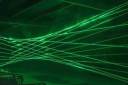 Laser beams of green light shooting out from an instrument